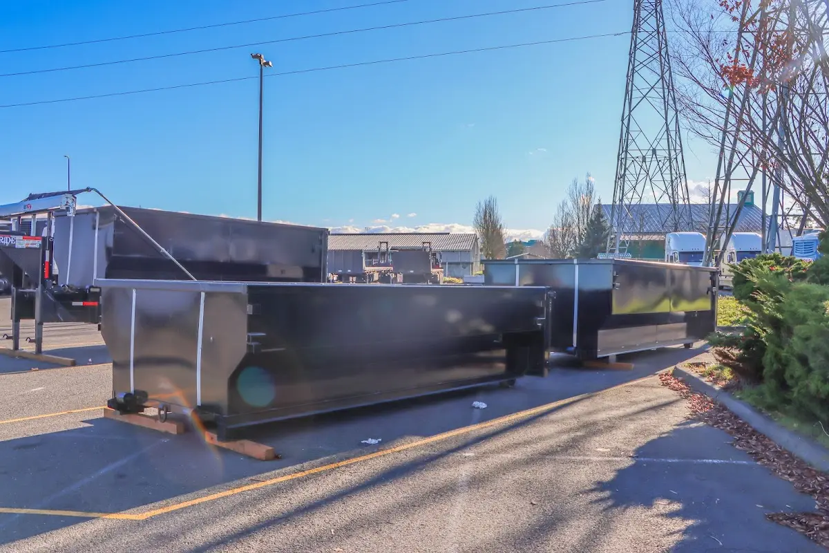 Roll-off dumpster ready for waste disposal at job site for 3 Yard Dumpster Rental in Wolfeboro